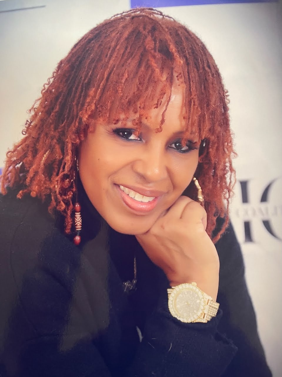 Client with vibrant styled locs from Mane Attractions by Ms. Rob